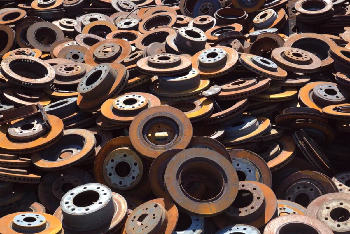 A mountain of scrap brake rotors at the yard, ready for processing